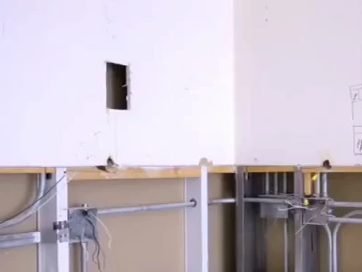Rough-in before the wall closes: steel studs, conduit and boxes set